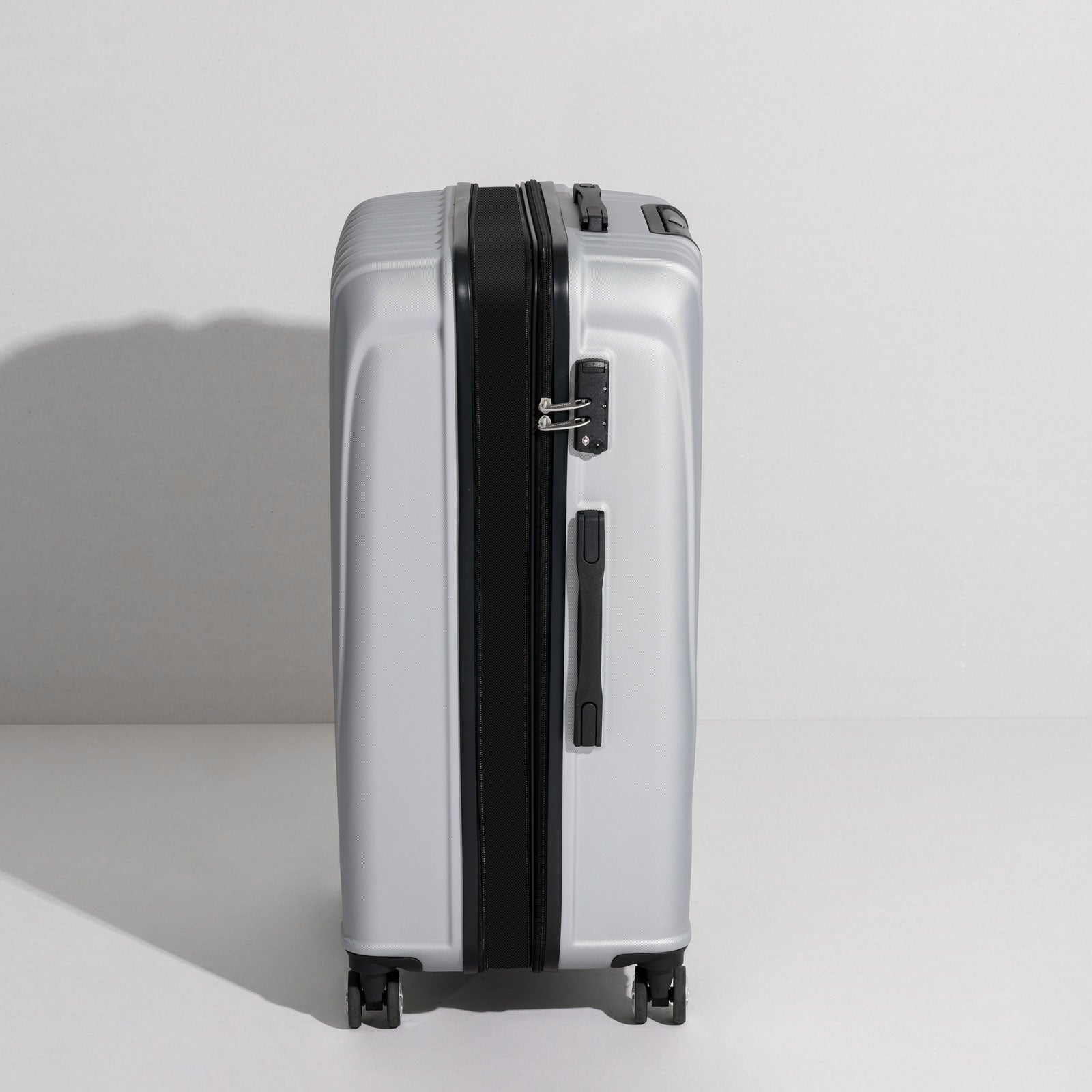 uiimiii silver large check-in luggage side